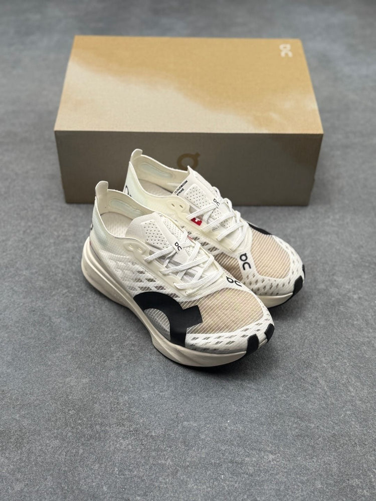 On Cloudboom Strike Cream Sneakers