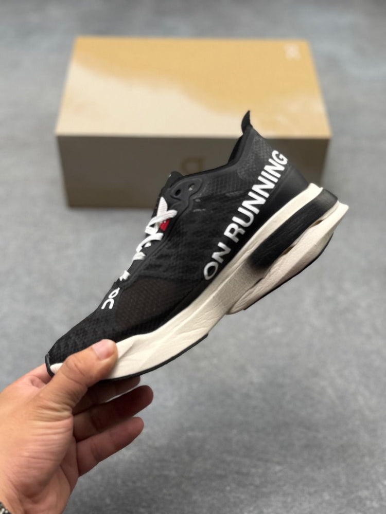 On Cloudboom Strike Black & White Sneakers