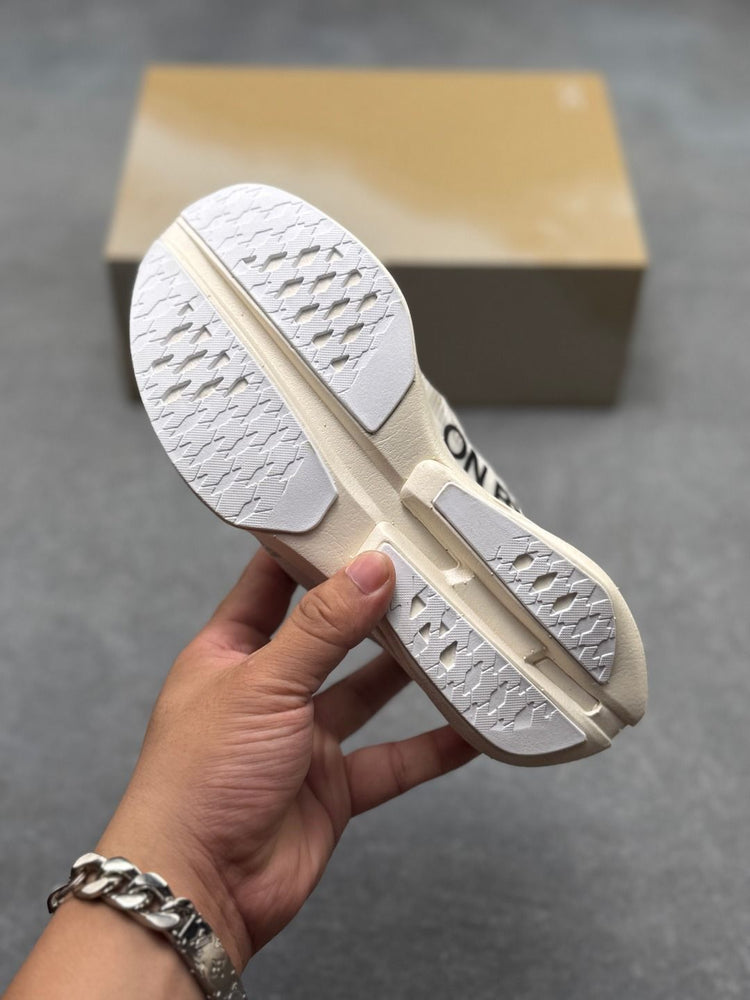 On Cloudboom Strike Cream Sneakers