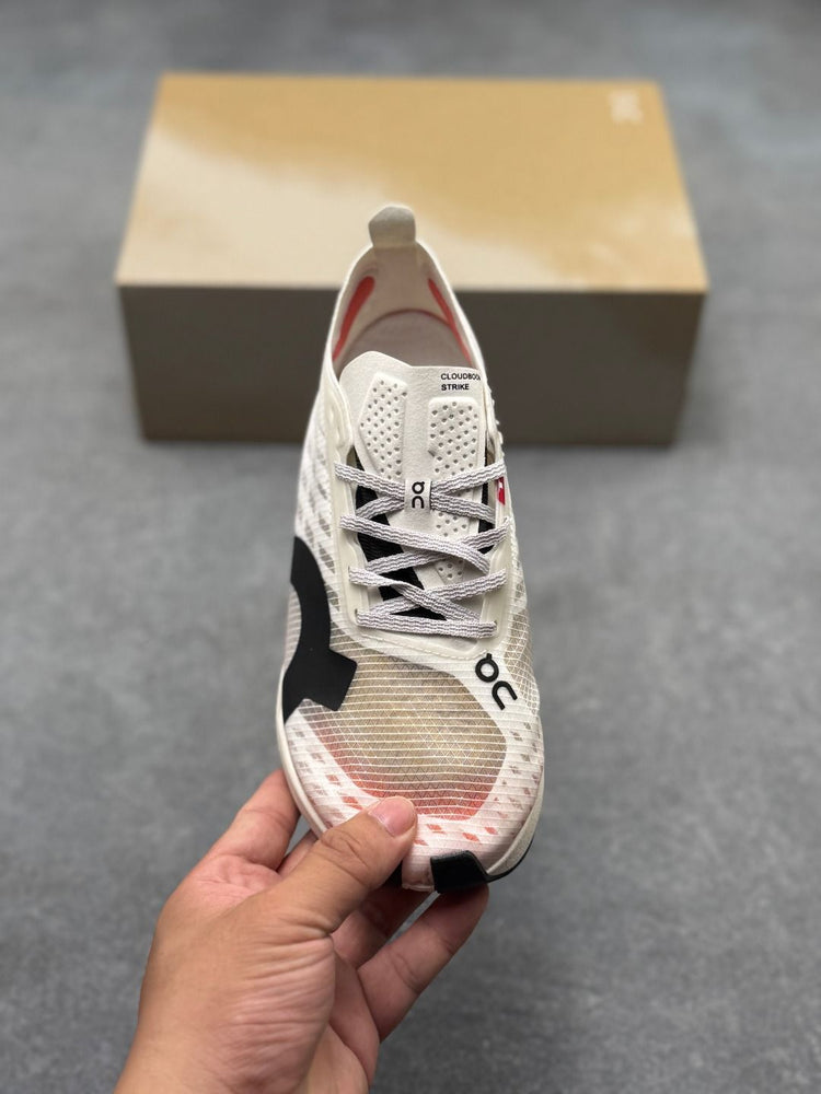On Cloudboom Strike Cream & Red Sneakers