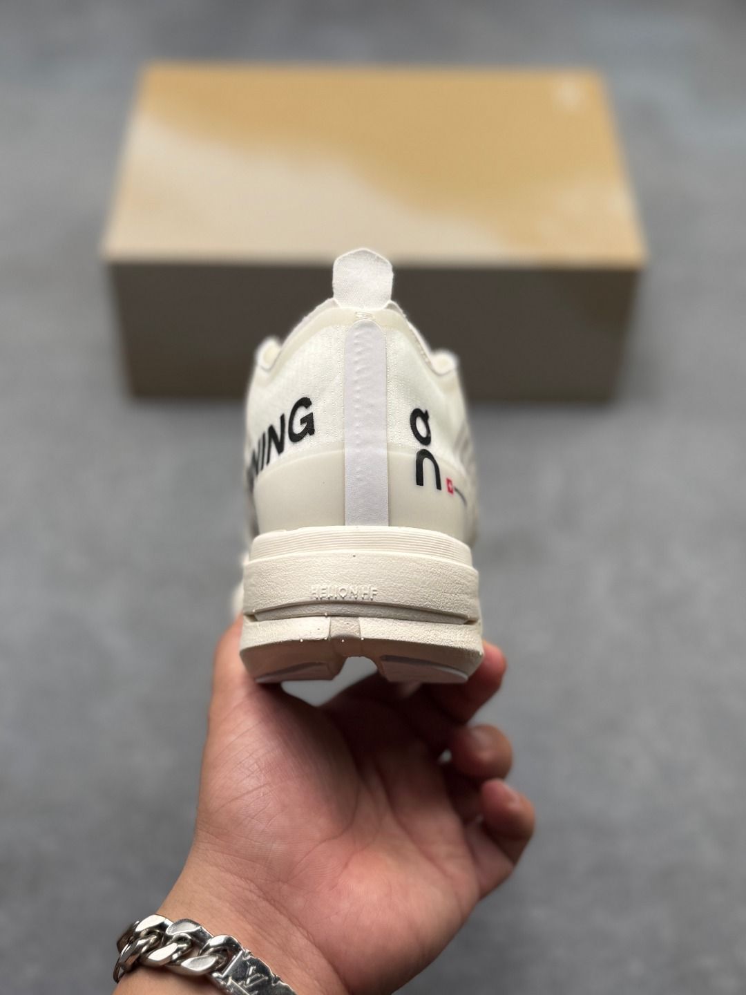 On Cloudboom Strike Cream Sneakers
