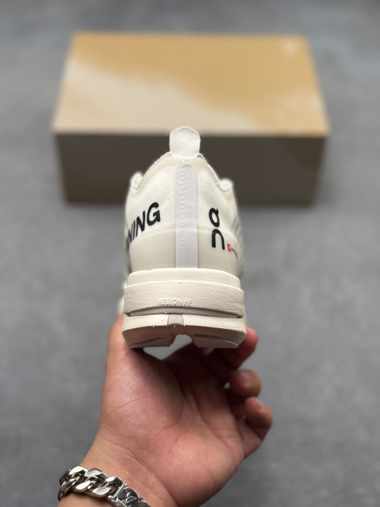 On Cloudboom Strike Cream Sneakers