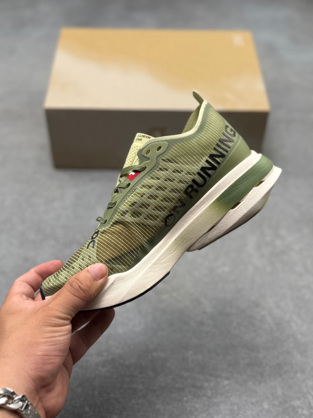 On Cloudboom Strike Olive & Cream Sneakers