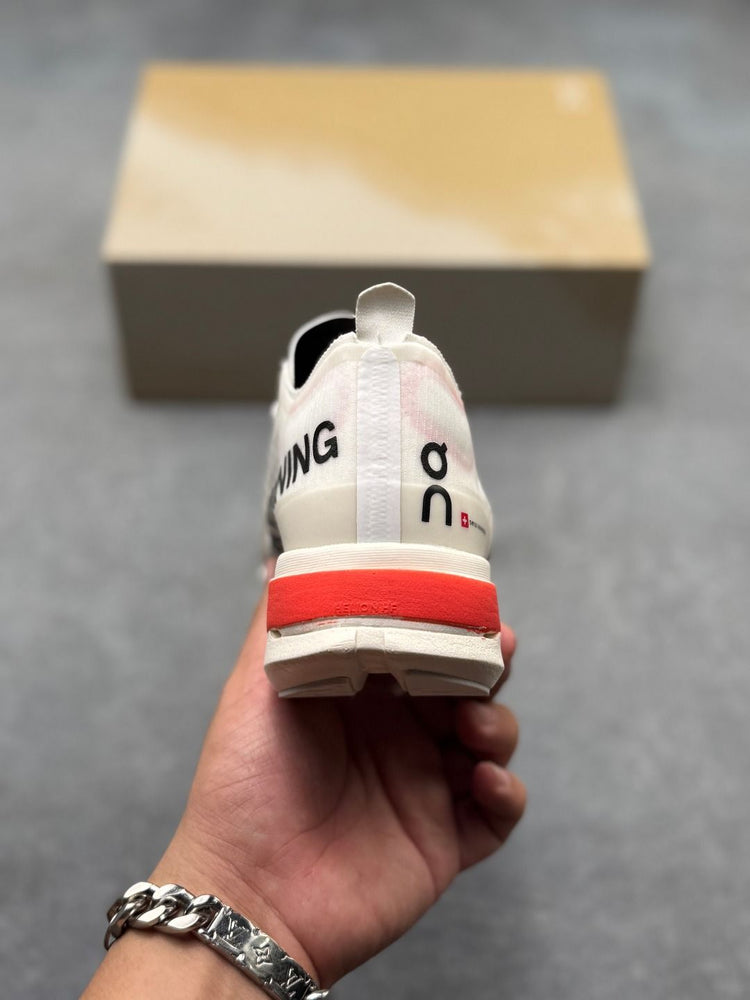 On Cloudboom Strike Cream & Red Sneakers