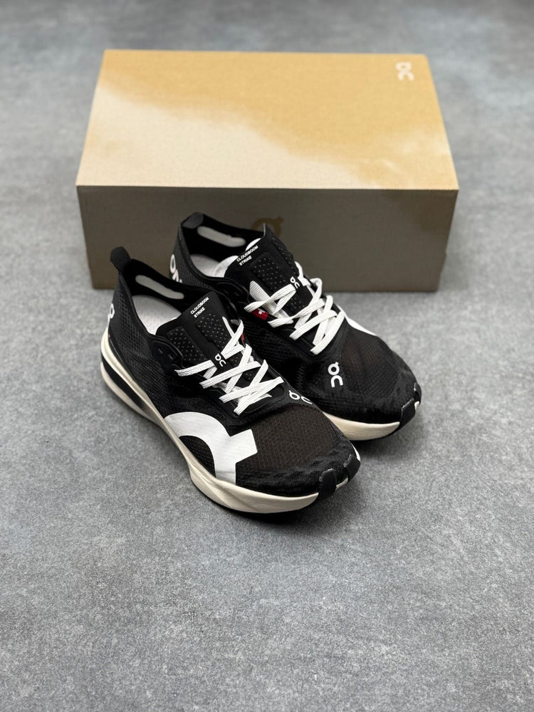 On Cloudboom Strike Black & White Sneakers