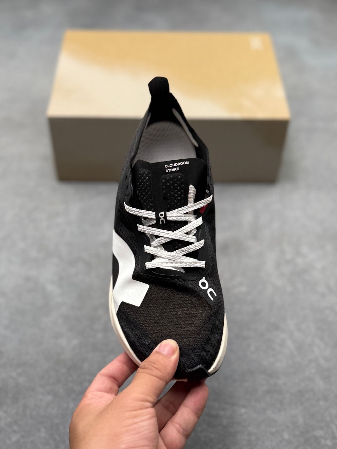 On Cloudboom Strike Black & White Sneakers