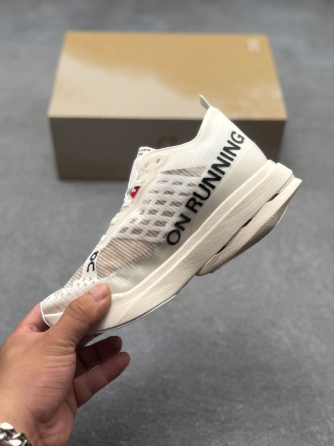On Cloudboom Strike Cream Sneakers