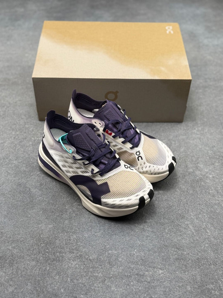On Cloudboom Strike Black & Cream Sneakers