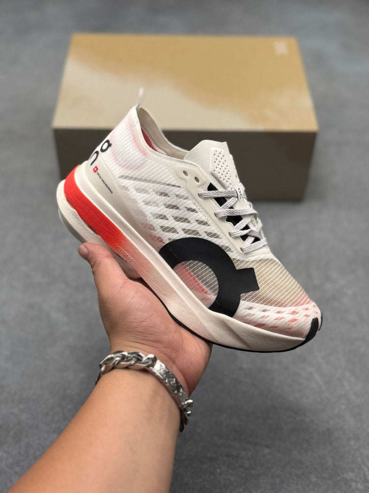 On Cloudboom Strike Cream & Red Sneakers