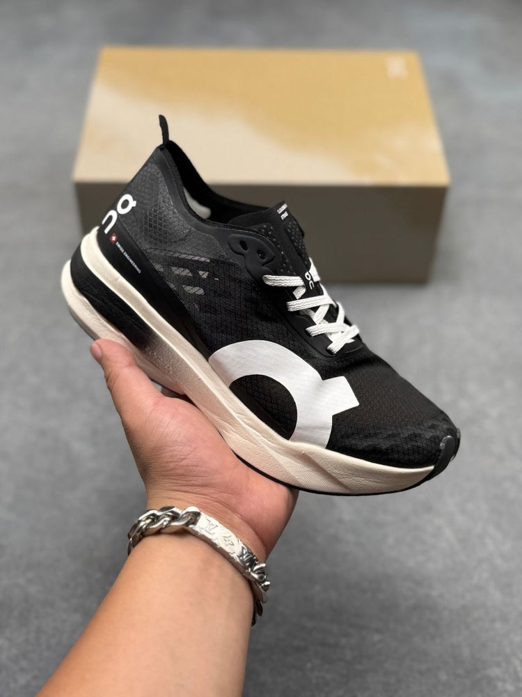 On Cloudboom Strike Black & White Sneakers