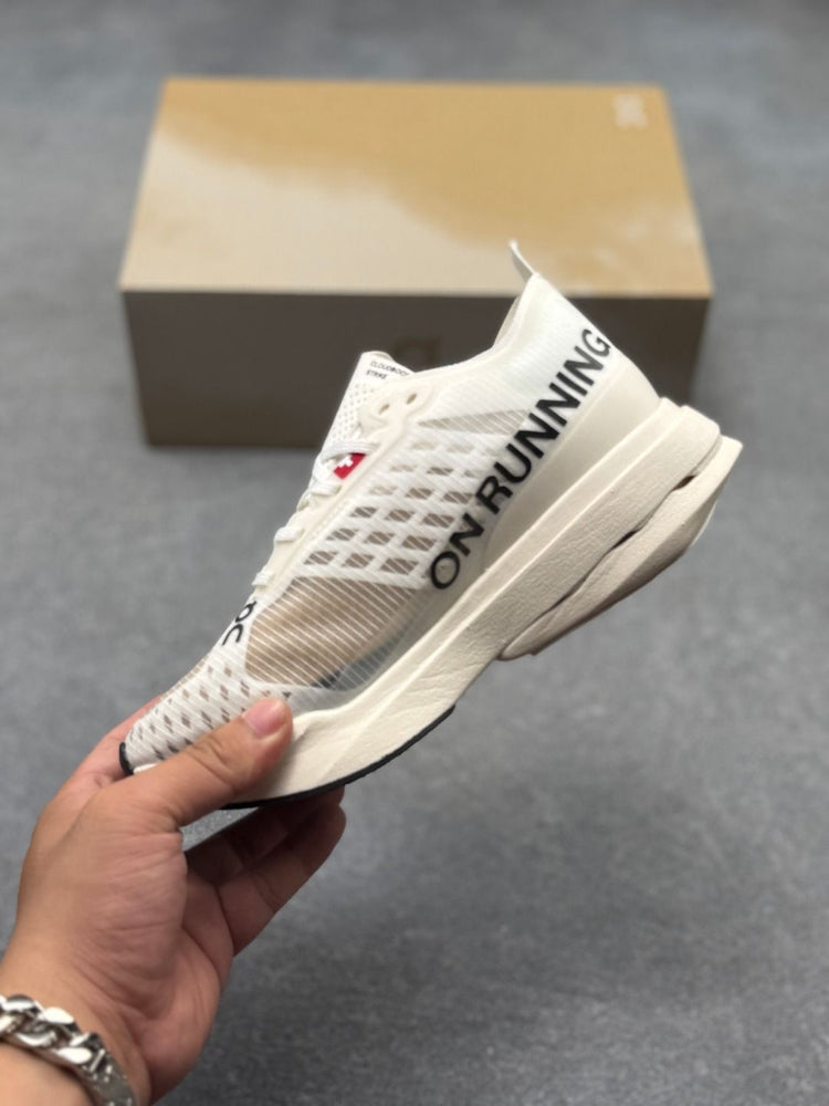 On Cloudboom Strike Cream Sneakers
