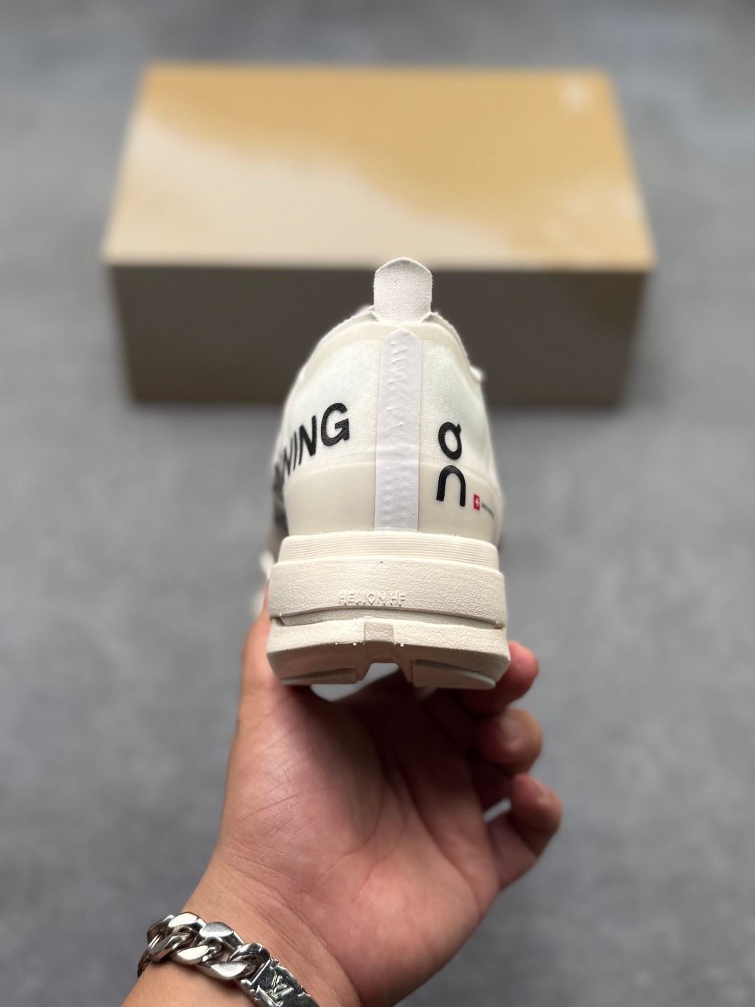 On Cloudboom Strike Cream Sneakers