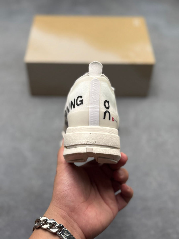 On Cloudboom Strike Cream Sneakers