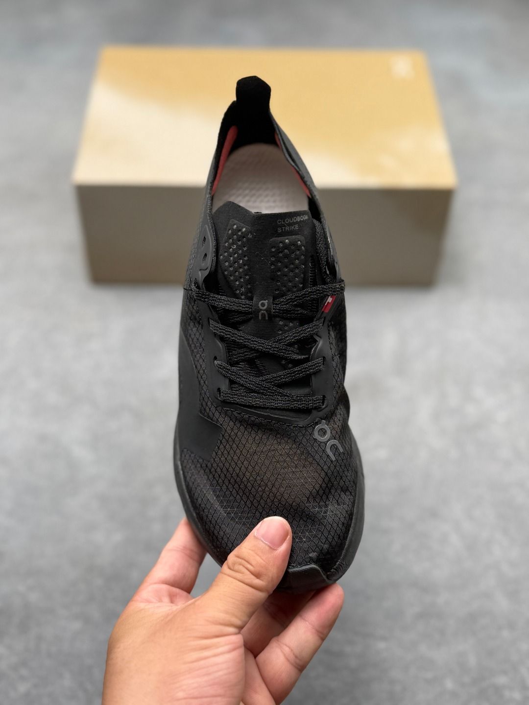 On Cloudboom Strike All-Black Sneakers