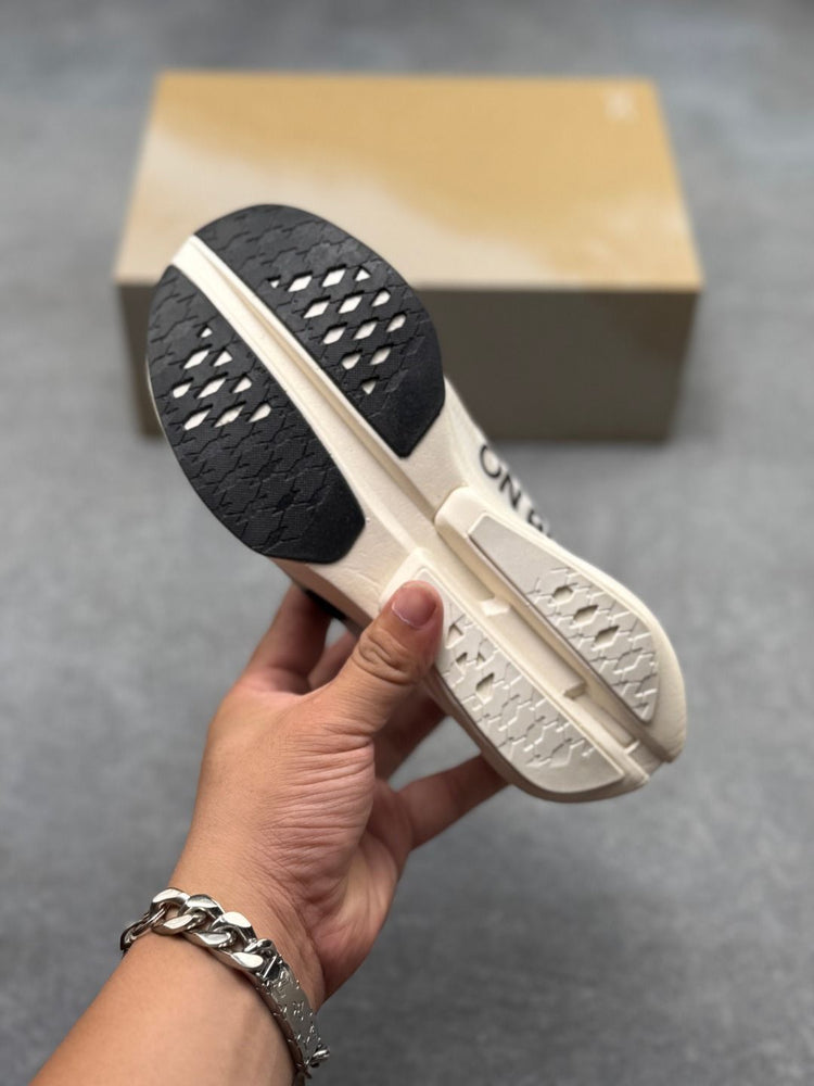 On Cloudboom Strike Cream Sneakers