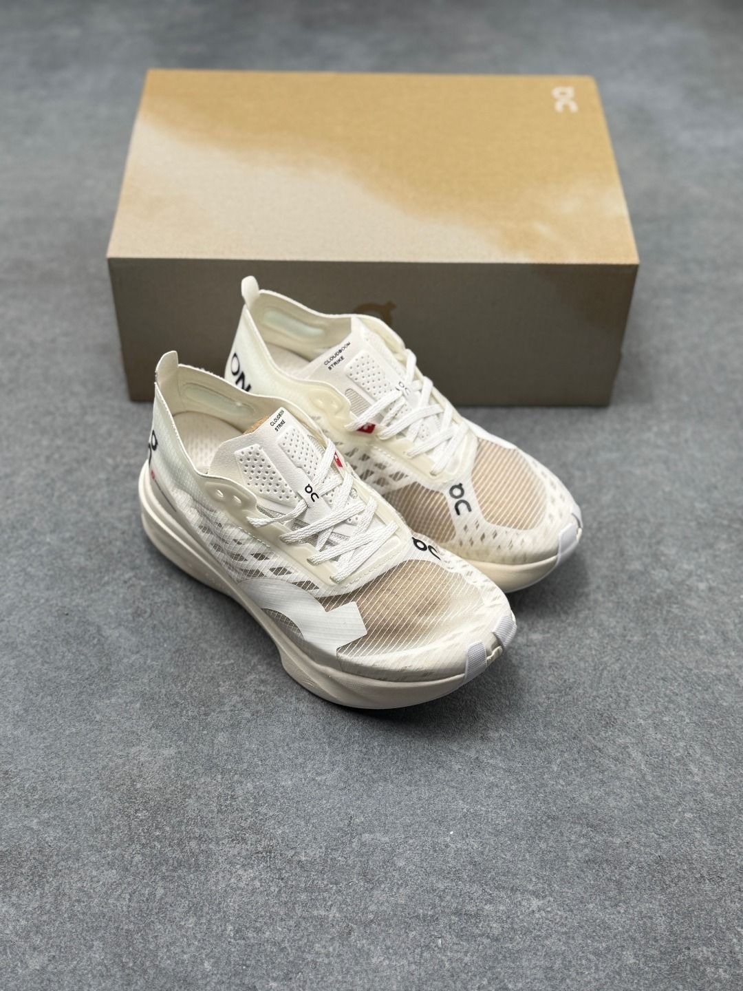 On Cloudboom Strike Cream Sneakers
