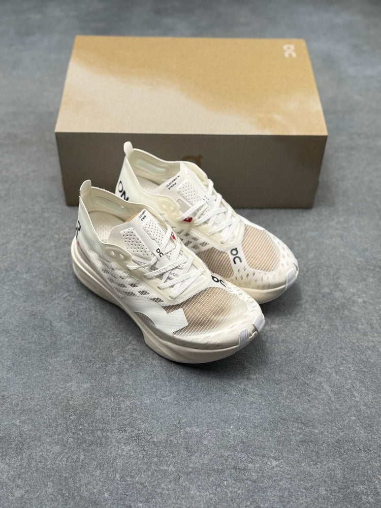 On Cloudboom Strike Cream Sneakers