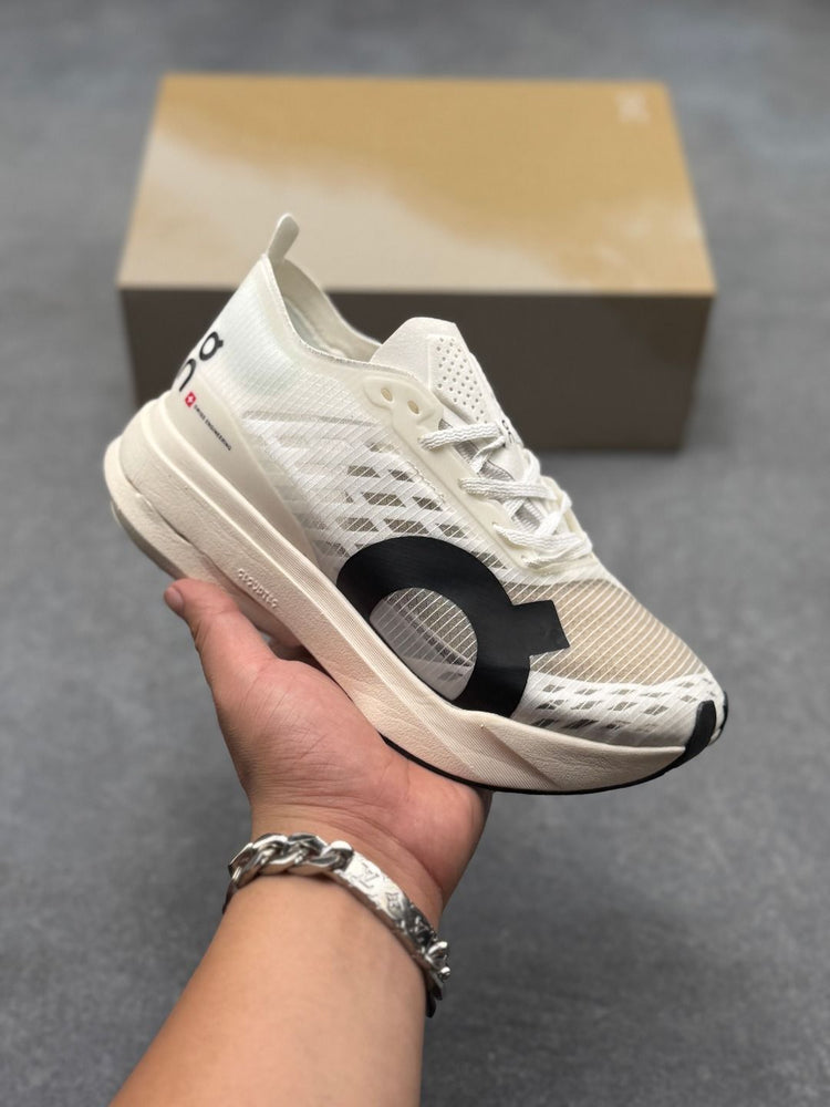 On Cloudboom Strike Cream Sneakers